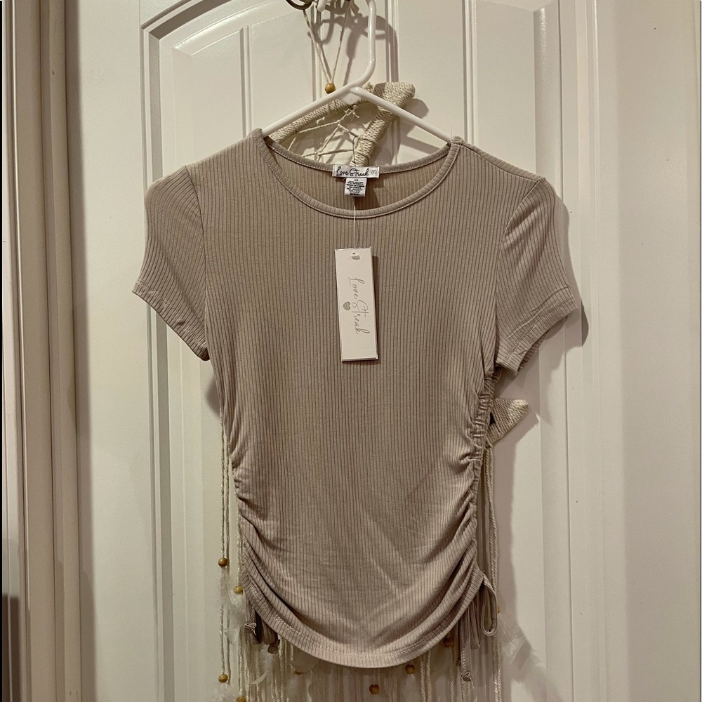 Beige colored tight top